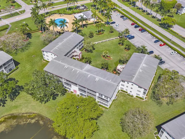an aerial view of residential houses with outdoor space and river