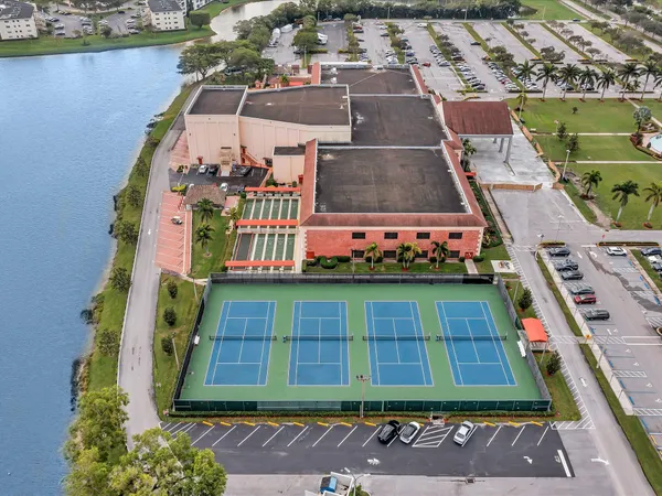 an aerial view of residential houses with outdoor space and swimming pool
