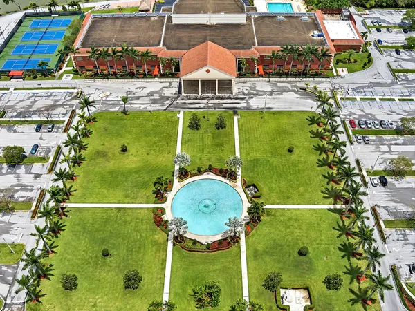 a view of a swimming pool with a table and chairs