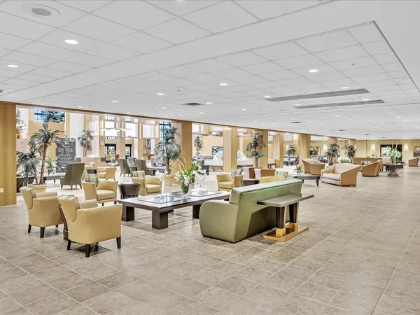 a large room with lots of table and chairs