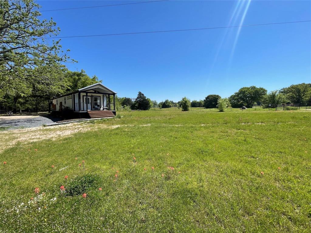 395 Vz County Road 3826 Wills Point, TX 75169 - Photo 2 of 2 a view of a large garden with plants and large trees