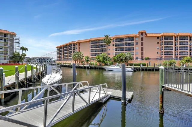 a view of a lake with a city skyline in the background