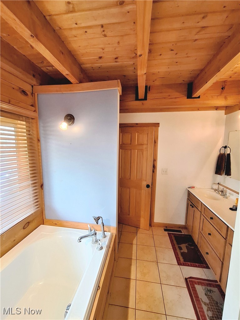 587 North Fork Road Wheeling, WV 26003 - Photo 22 of 35 Full bath featuring beam ceiling, a garden tub, wooden ceiling, tile patterned flooring, and vanity