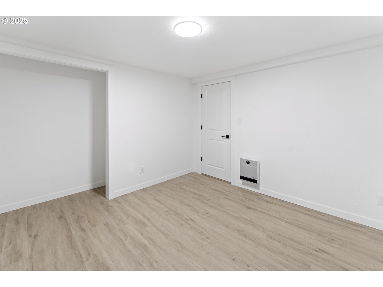 47875 Elgin Avenue Oakridge, OR 97463 - Photo 11 of 22 a view of an empty room with wooden floor