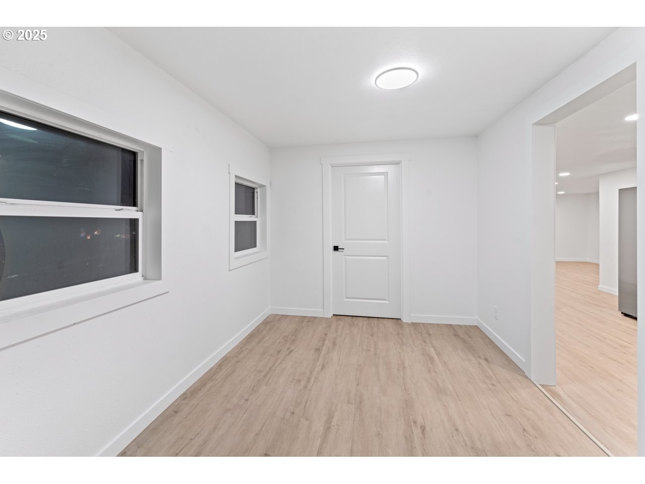 47875 Elgin Avenue Oakridge, OR 97463 - Photo 2 of 22 a view of an empty room with wooden floor and a window