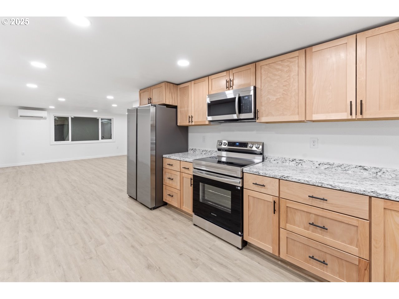 47875 Elgin Avenue Oakridge, OR 97463 - Photo 6 of 22 a kitchen with stainless steel appliances granite countertop a refrigerator and a stove top oven