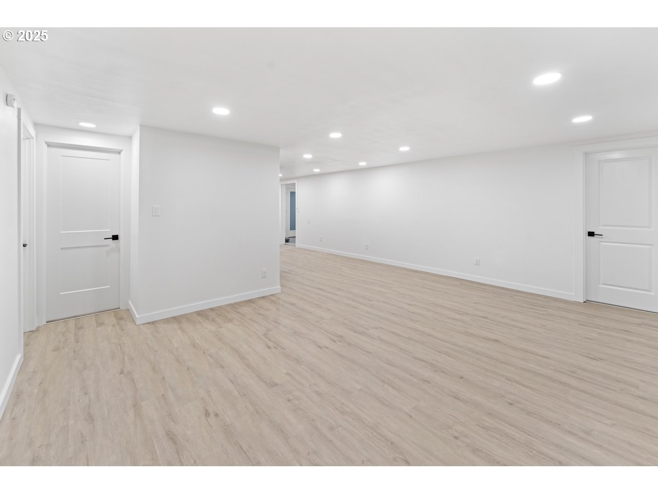 47875 Elgin Avenue Oakridge, OR 97463 - Photo 9 of 22 a view of an empty room with wooden floor