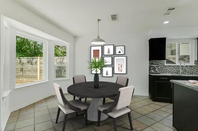 a dining room with furniture a window and a chandelier