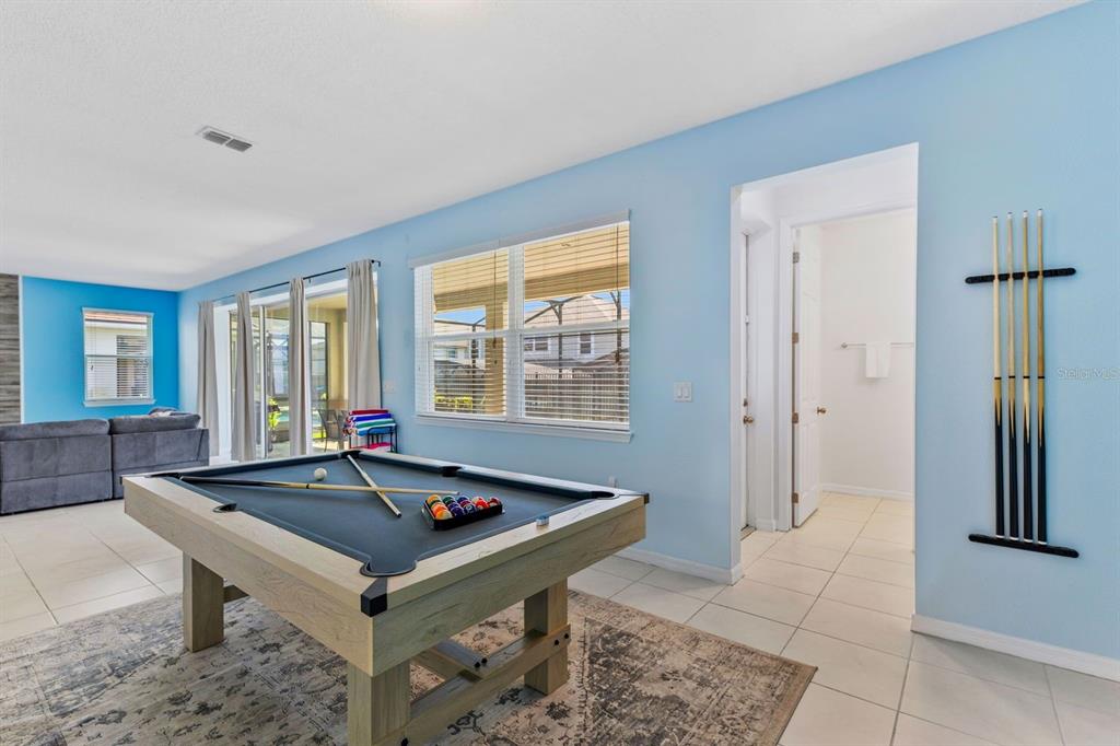 9042 Sunshine Ridge Loop Kissimmee, FL 34747 - Photo 11 of 44 a room with pool table and windows