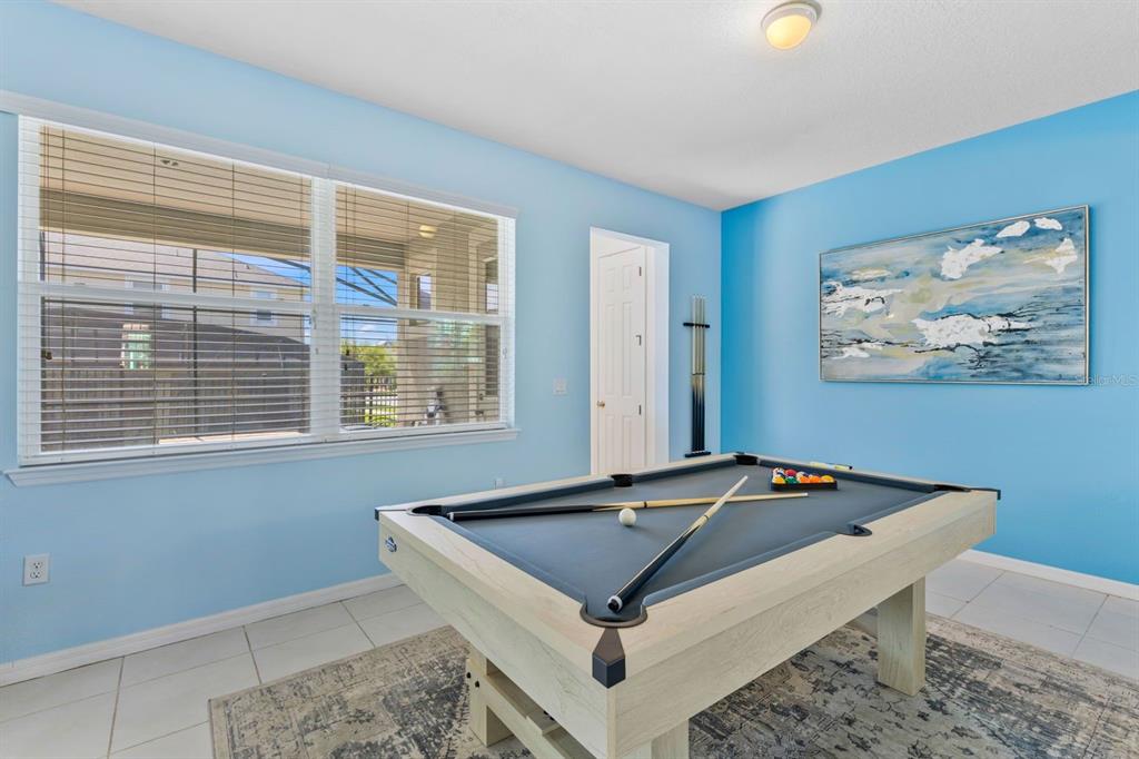 9042 Sunshine Ridge Loop Kissimmee, FL 34747 - Photo 12 of 44 a room with pool table and windows