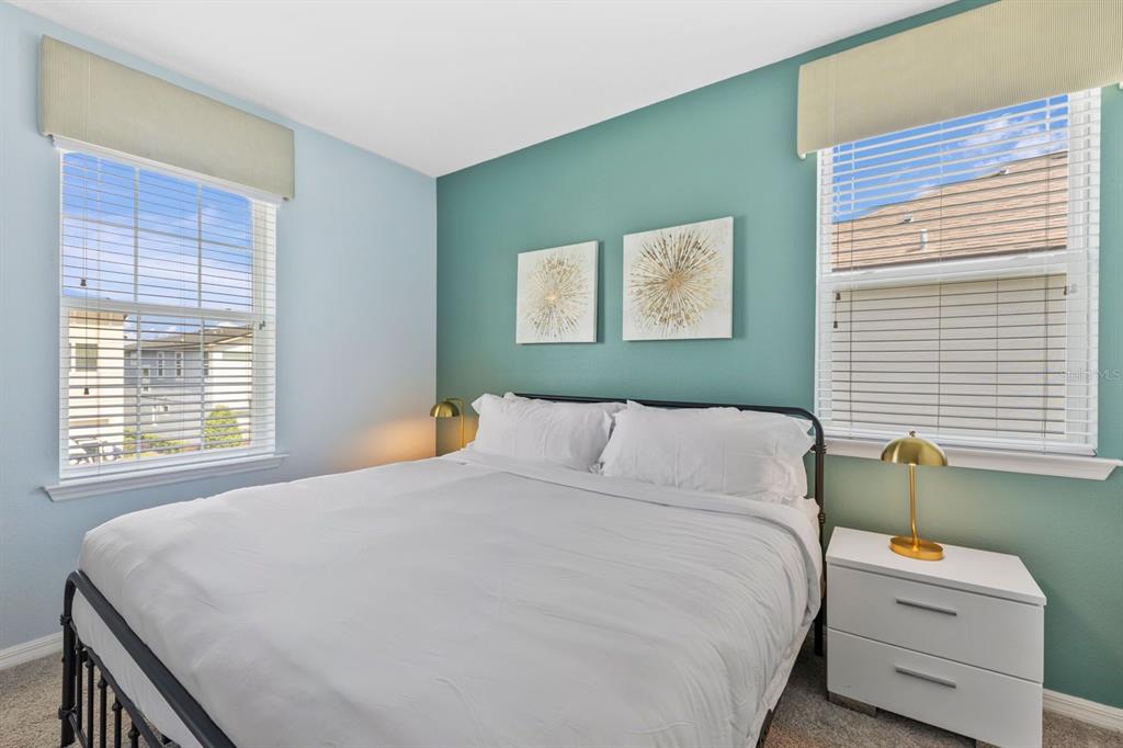 9042 Sunshine Ridge Loop Kissimmee, FL 34747 - Photo 27 of 44 a bedroom with a bed and a window