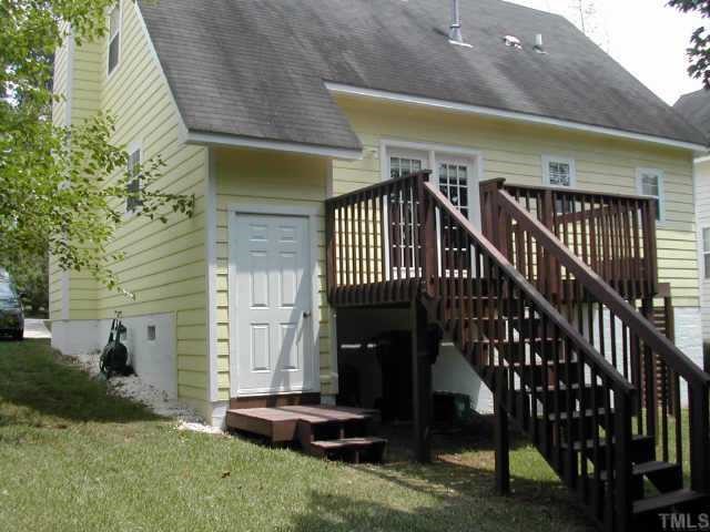 1053 Mills Street Raleigh, NC 27608 - Photo 7 of 10 a view of front door and porch with furniture