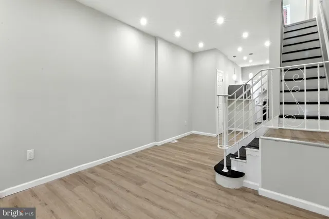 a view of entryway with wooden floor