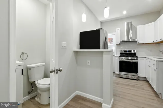 a view of a kitchen with a sink and a stove