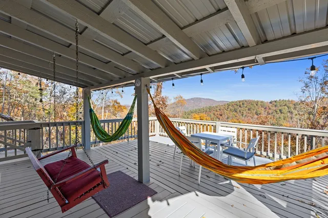 a view of a balcony with furniture