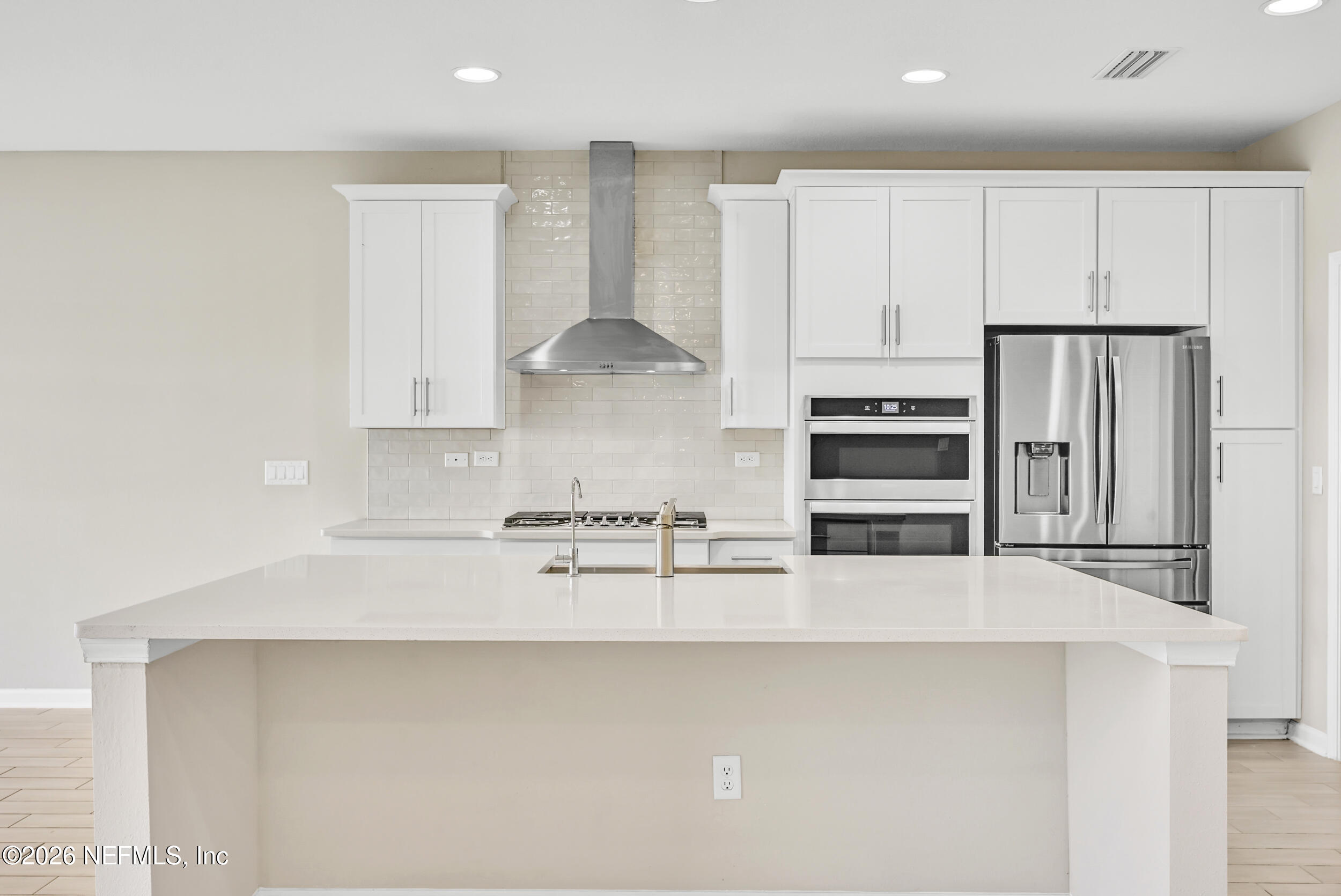 63 Goldcrest Way St. Augustine, FL 32092 - Photo 12 of 56 a kitchen with stainless steel appliances a sink a stove a refrigerator and cabinets
