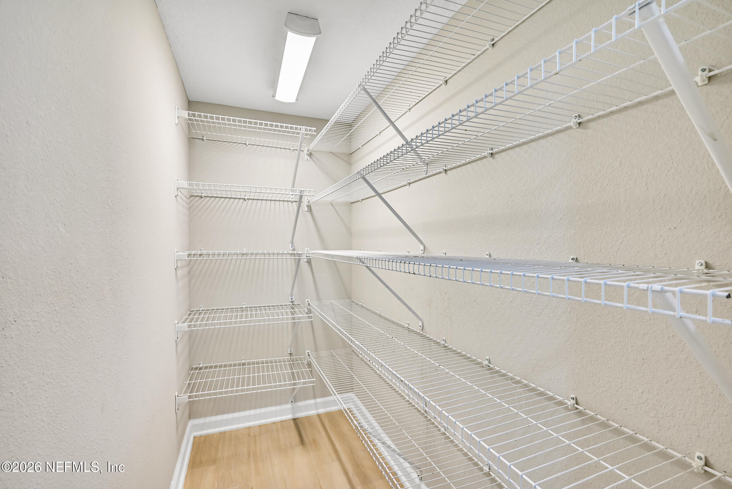 63 Goldcrest Way St. Augustine, FL 32092 - Photo 16 of 56 a view of walk in closet with empty racks