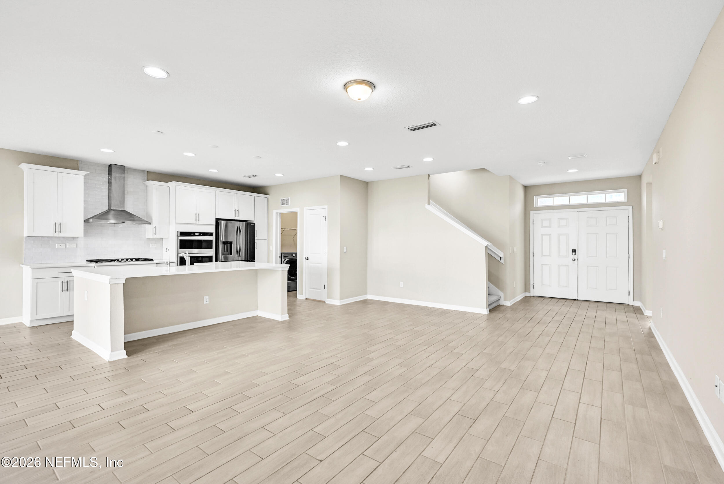 63 Goldcrest Way St. Augustine, FL 32092 - Photo 17 of 56 a view of kitchen with kitchen island white cabinets and stainless steel appliances