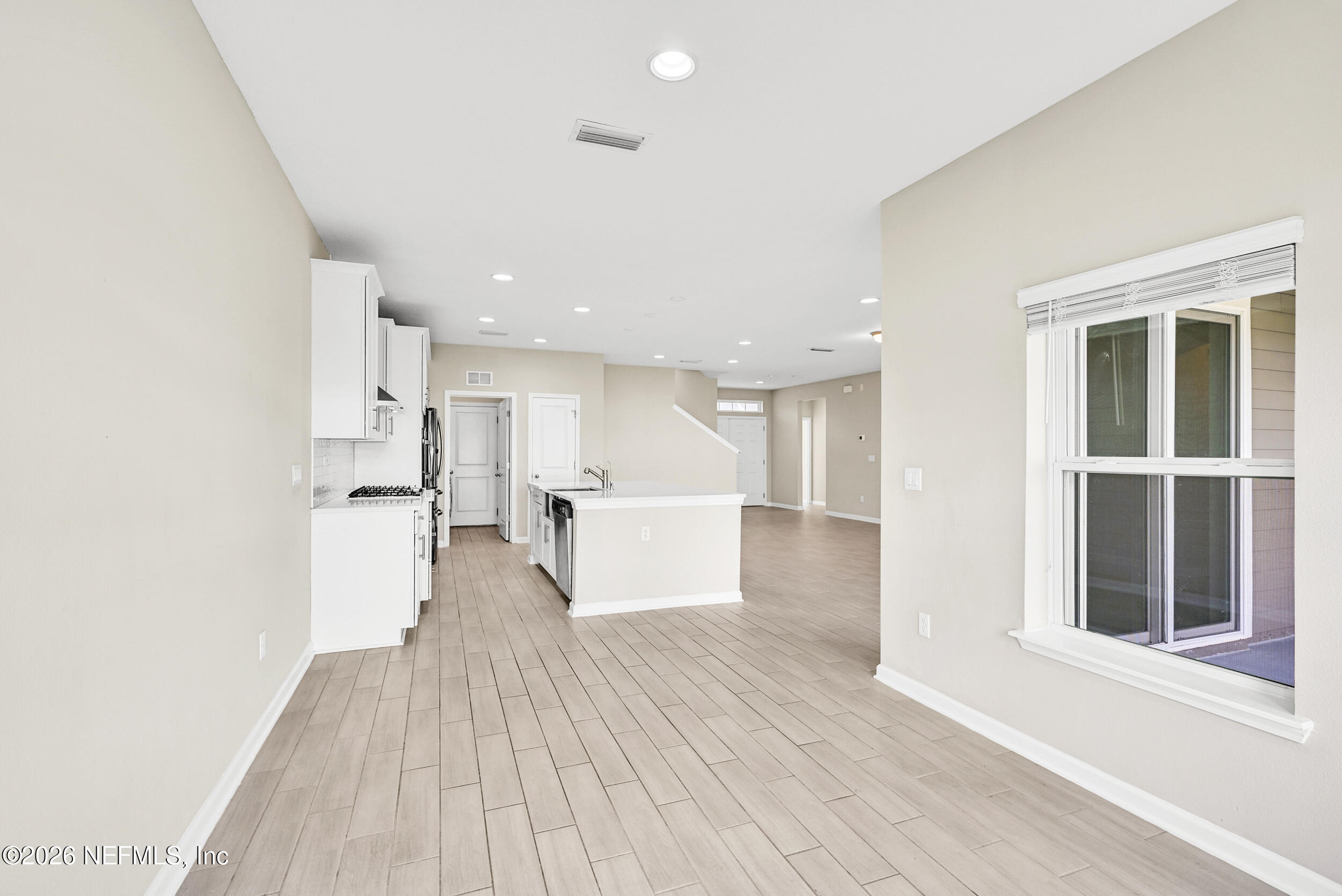 63 Goldcrest Way St. Augustine, FL 32092 - Photo 20 of 56 a view of empty room with wooden floor and windows
