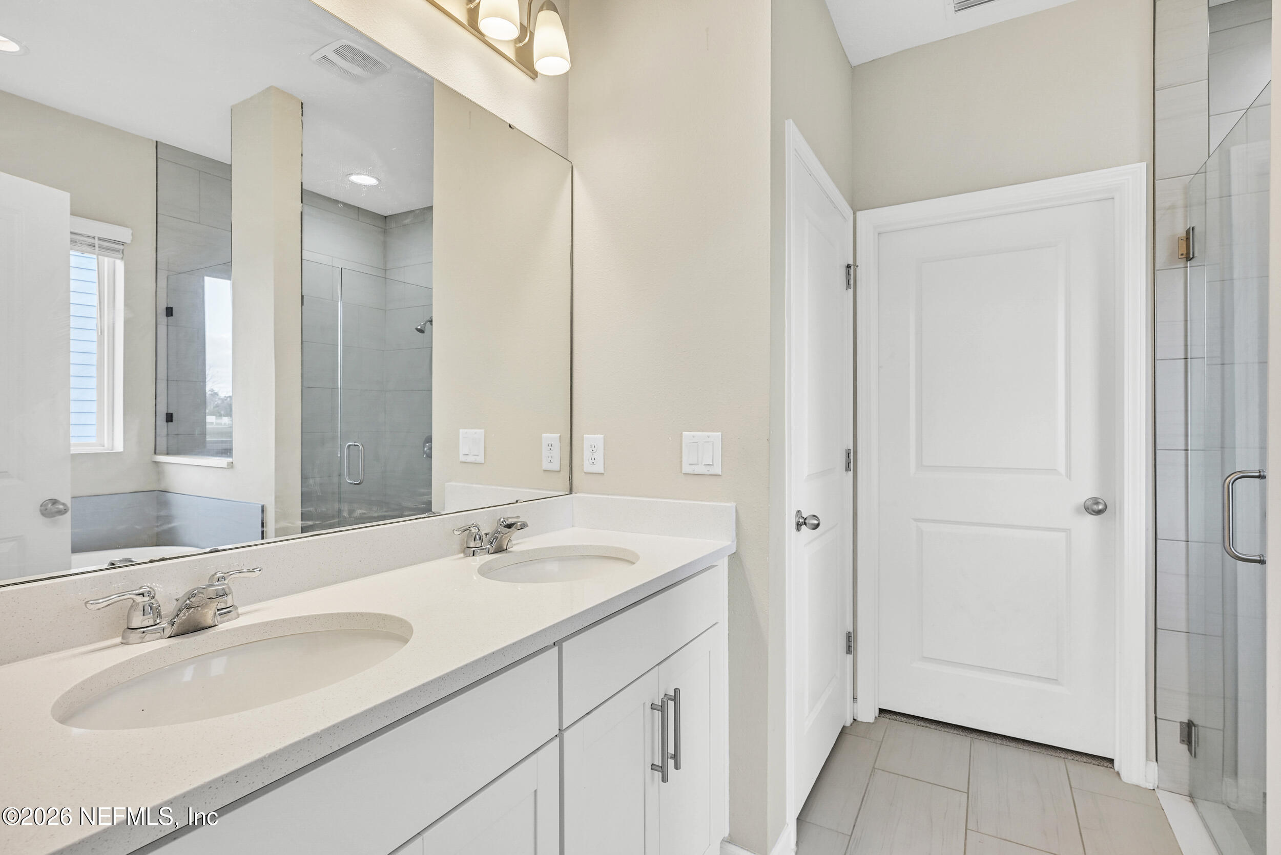 63 Goldcrest Way St. Augustine, FL 32092 - Photo 23 of 56 a bathroom with a sink and a mirror