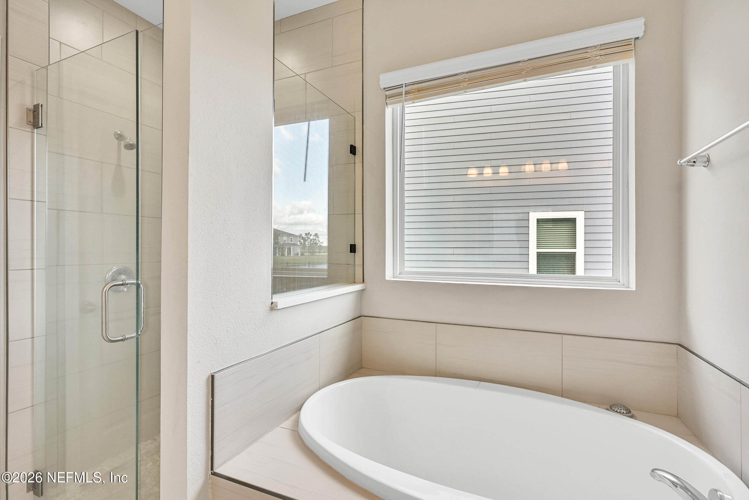 63 Goldcrest Way St. Augustine, FL 32092 - Photo 25 of 56 a white toilet sitting next to a bathroom next to a window