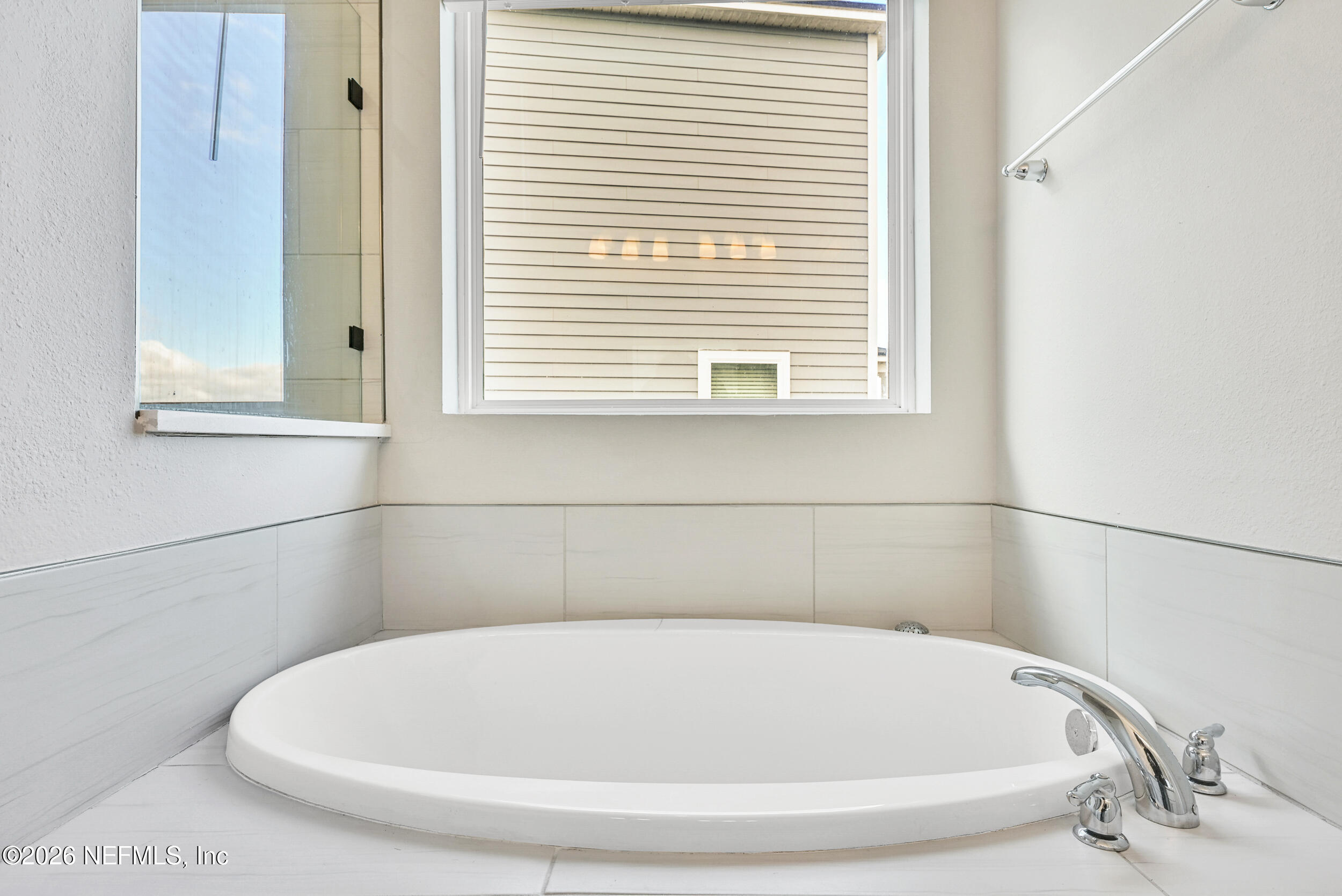 63 Goldcrest Way St. Augustine, FL 32092 - Photo 26 of 56 a white bath tub sitting in a bathroom