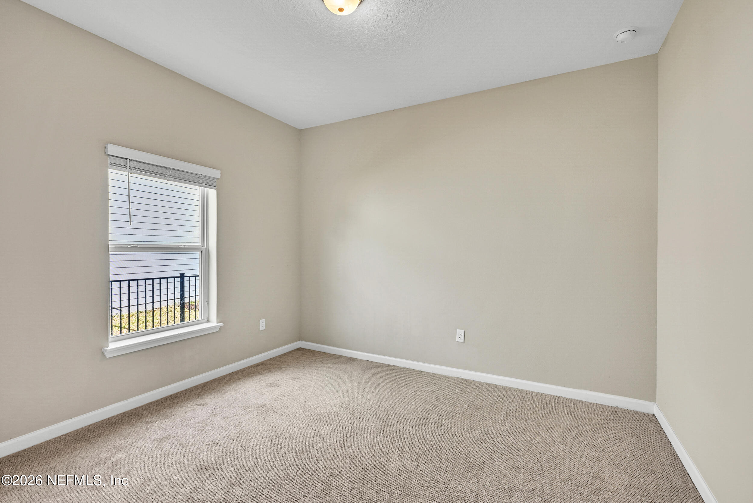 63 Goldcrest Way St. Augustine, FL 32092 - Photo 31 of 56 an empty room with windows