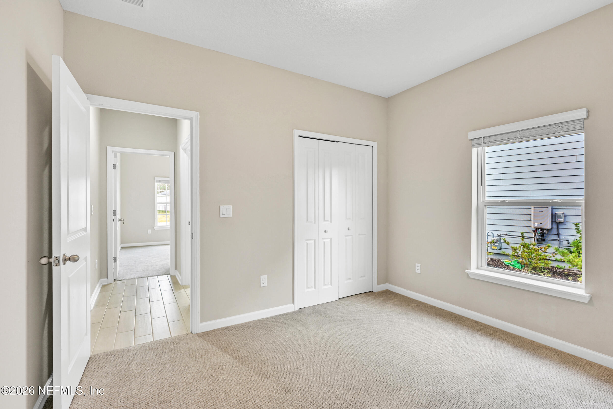 63 Goldcrest Way St. Augustine, FL 32092 - Photo 32 of 56 an empty room with windows and closet
