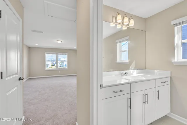 a view of a lake with houses in the back