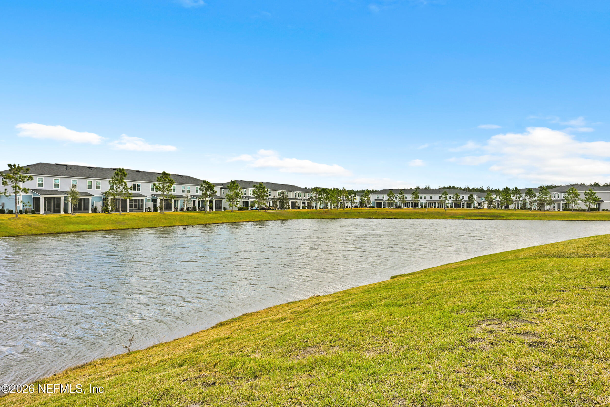 63 Goldcrest Way St. Augustine, FL 32092 - Photo 41 of 56 a view of a lake with houses in the back