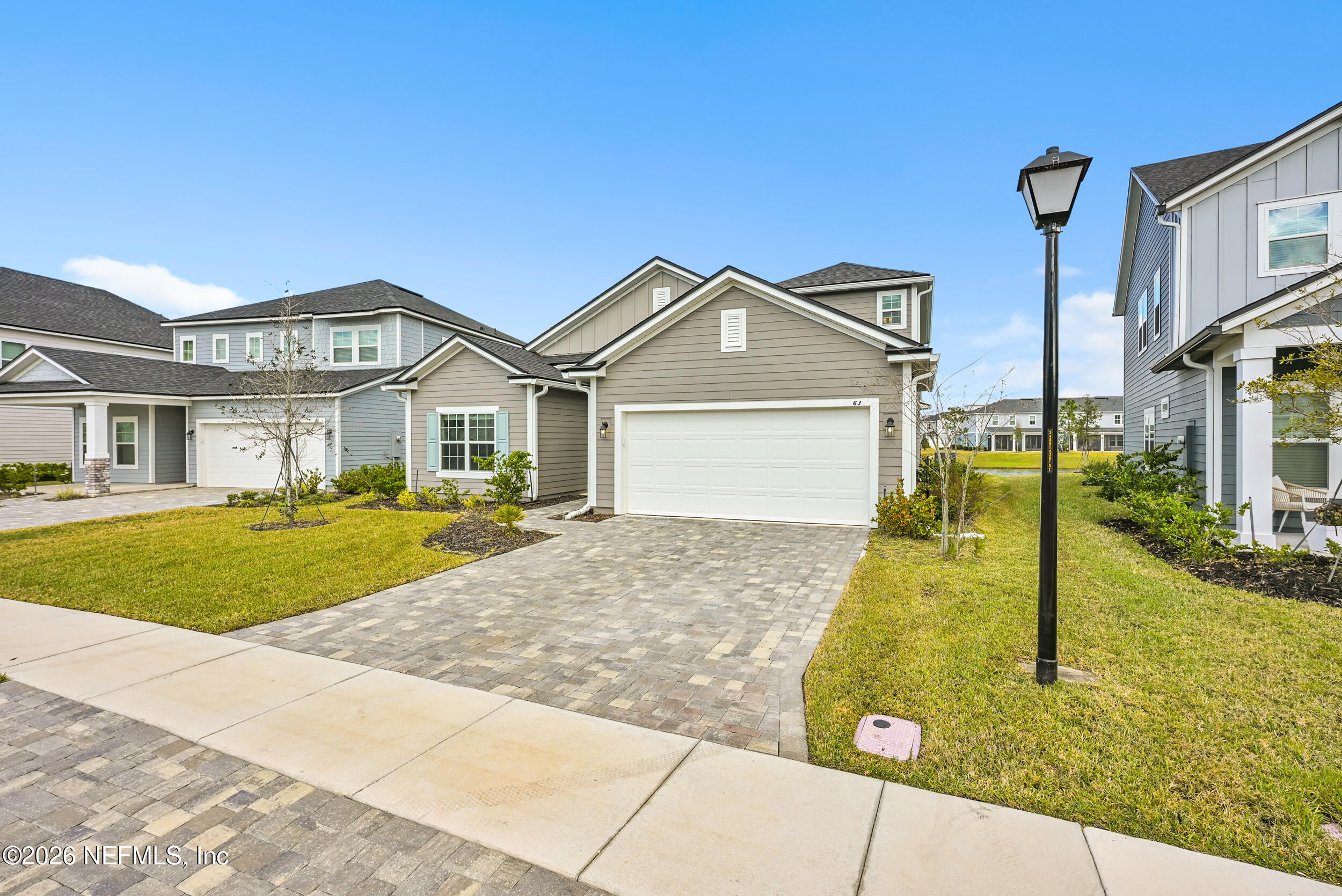 63 Goldcrest Way St. Augustine, FL 32092 - Photo 5 of 56 a front view of a house with a yard