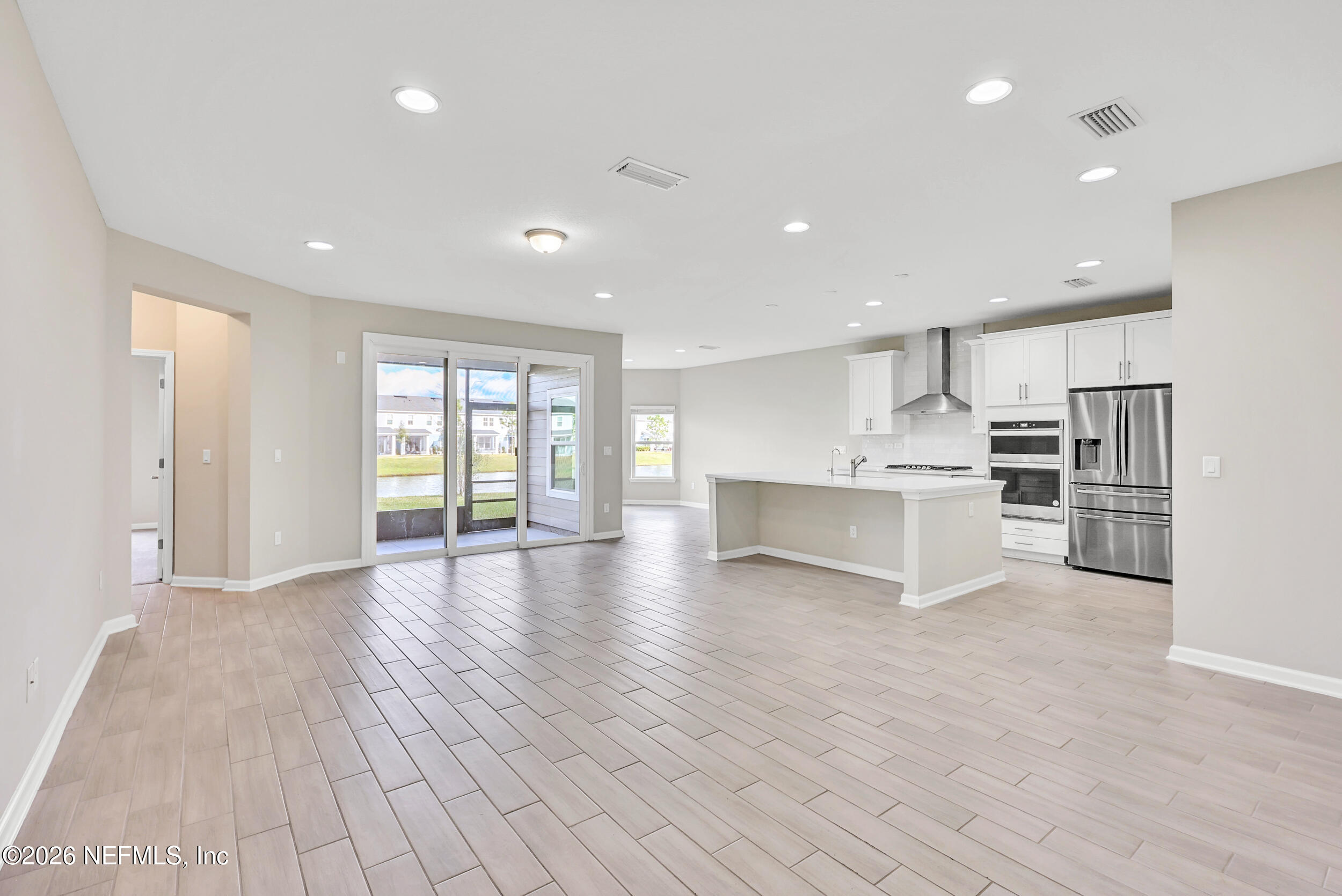 63 Goldcrest Way St. Augustine, FL 32092 - Photo 10 of 56 a view of kitchen with wooden floor and electronic appliances
