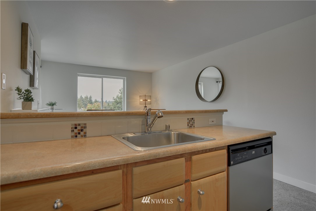 9200 Greenwood Avenue North, Unit 104 Seattle, WA 98103 - Photo 11 of 19 a bathroom with a sink and a mirror