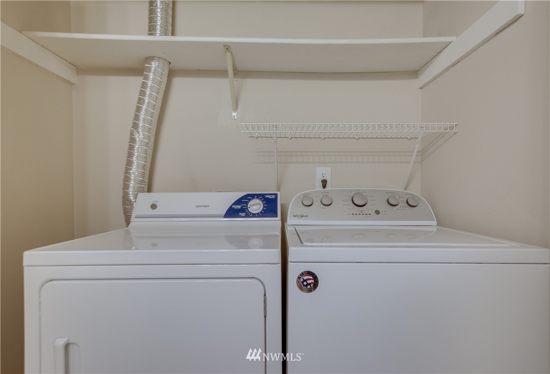 9200 Greenwood Avenue North, Unit 104 Seattle, WA 98103 - Photo 16 of 19 a utility room with dryer and washer
