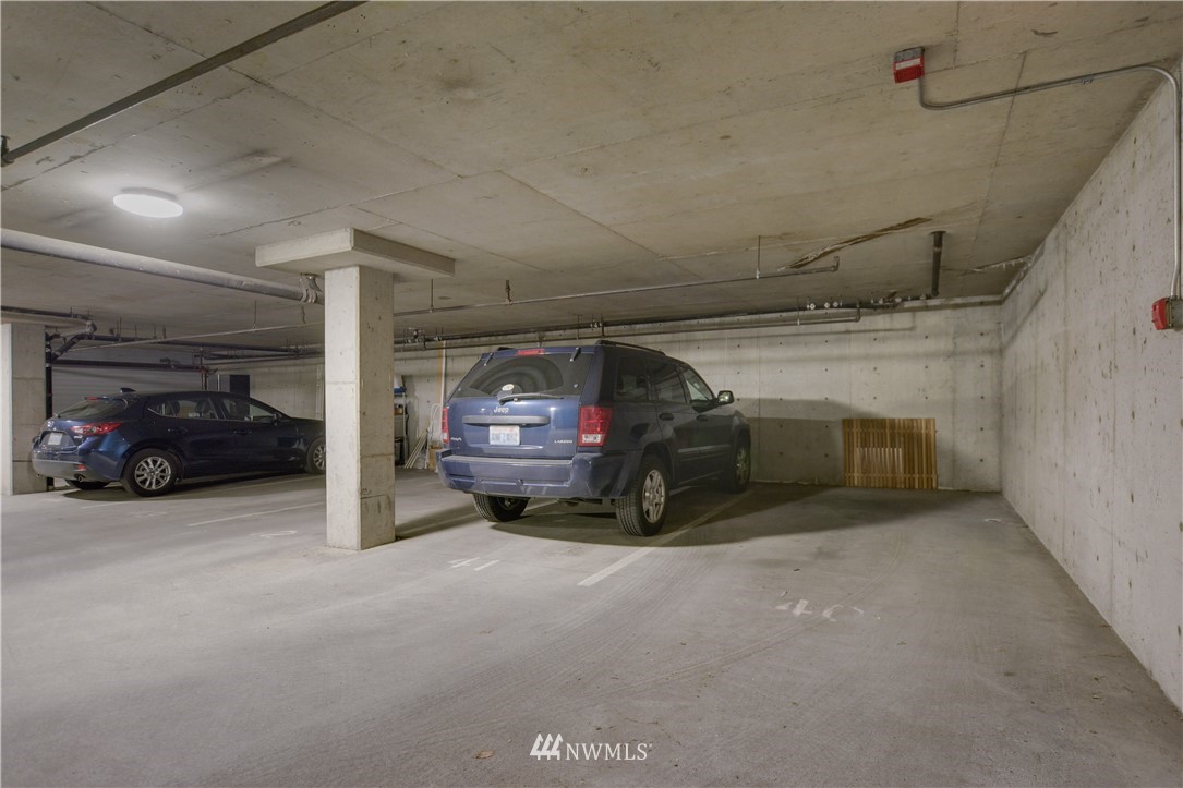 9200 Greenwood Avenue North, Unit 104 Seattle, WA 98103 - Photo 17 of 19 a view of parking garage with cars