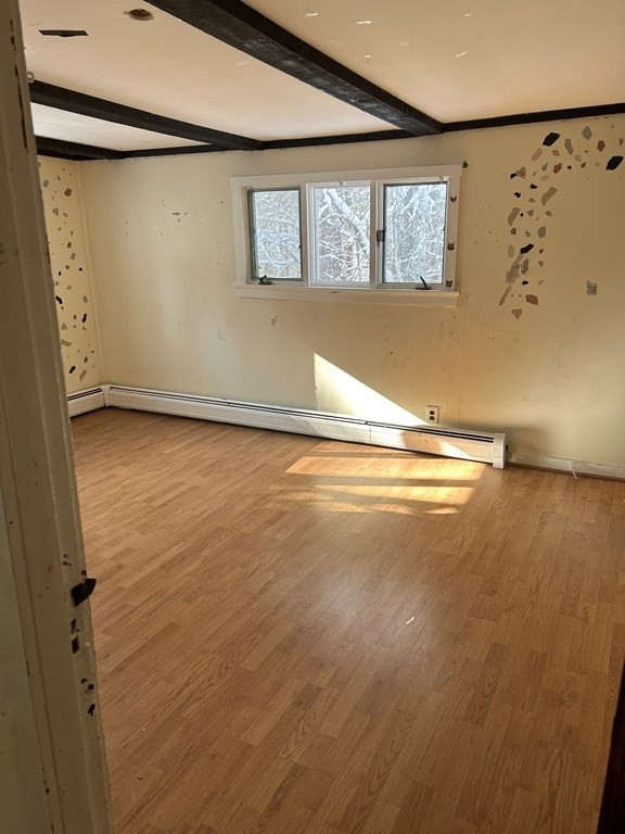 65 Shawsheen Road Billerica, MA 01821 - Photo 6 of 10 a view of a room with wooden floor and windows