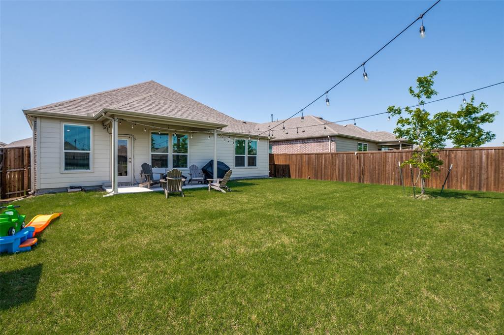 1005 Adelyn Street Anna, TX 75409 - Photo 11 of 12 a view of a house with backyard and porch