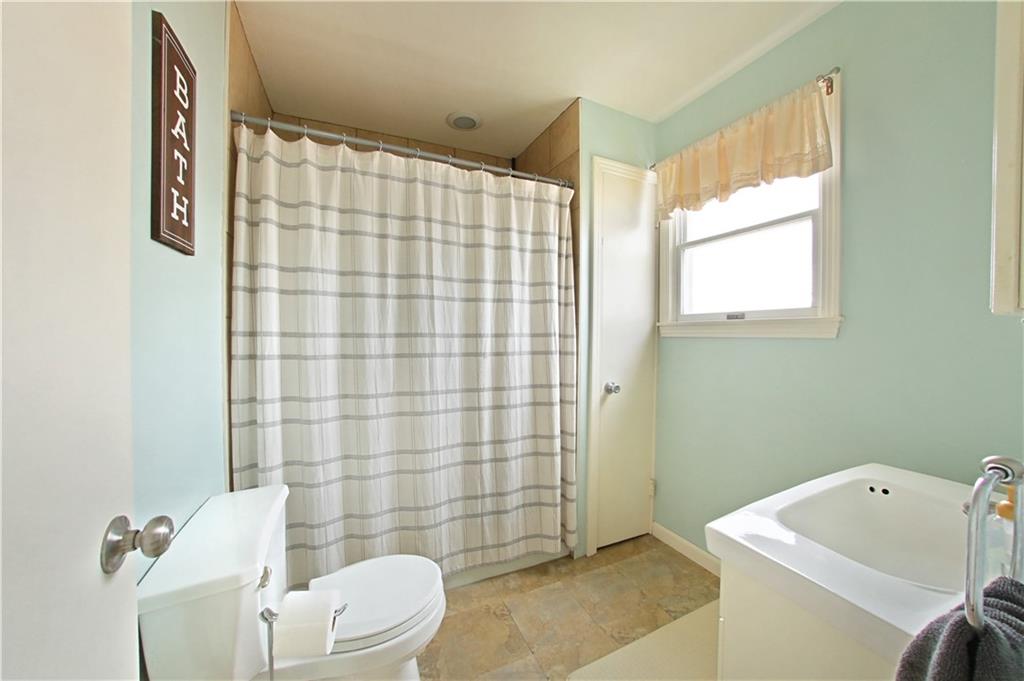 985 Ridge Road Bridgeville, PA 15017 - Photo 15 of 22 CERAMIC TILED SHOWER. LINEN CLOSET FOR STORAGE.