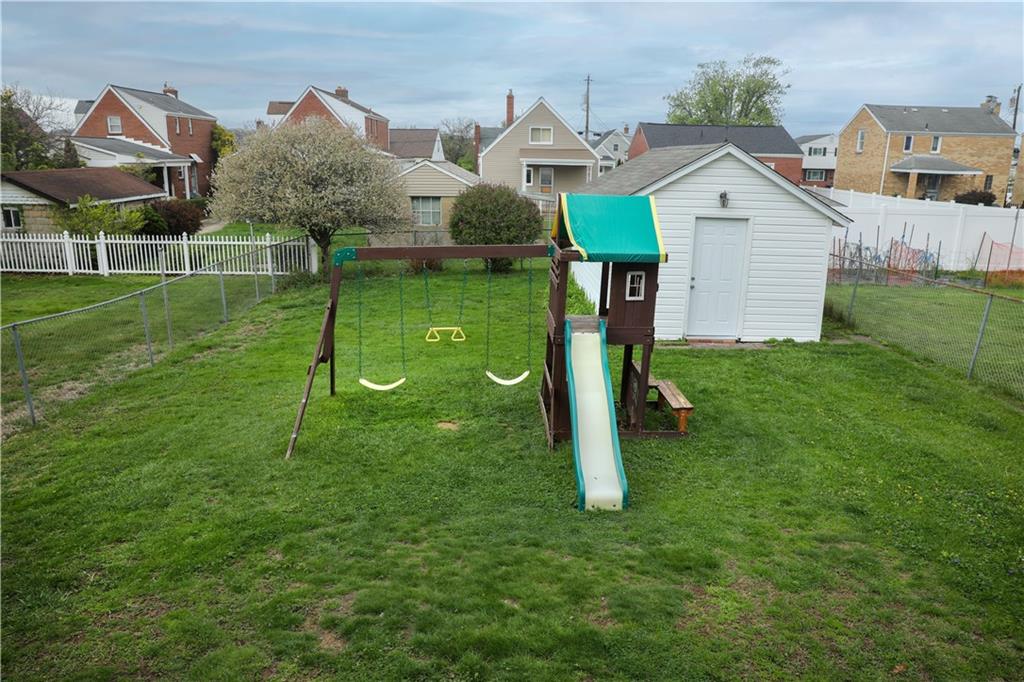 985 Ridge Road Bridgeville, PA 15017 - Photo 19 of 22 LEVEL FENCED BACKYARD. LARGE SHED PROVIDES SPACE FOR OUTDOOR EQUIPMENT.