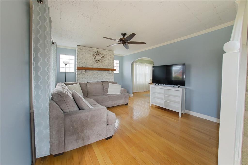 985 Ridge Road Bridgeville, PA 15017 - Photo 3 of 22 YOU ARE GREETED BY HARDWOOD FLOORS PLUS A FLOOR TO CEILING BRICK WODD BURNING FIREPLACE.