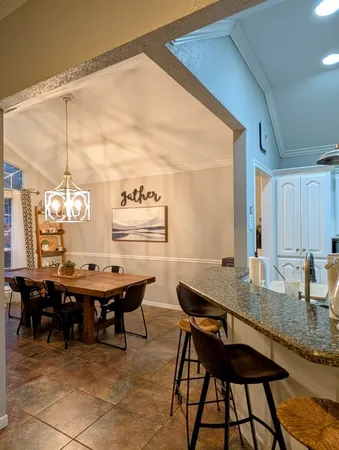 a view of a dining table and chairs