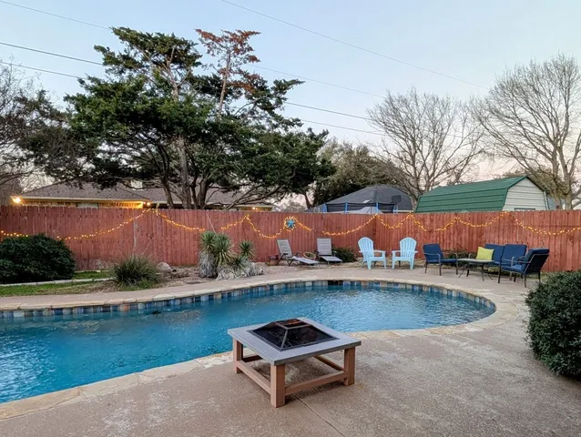 an aerial view of a house with lake view