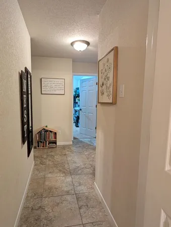 a bedroom with furniture and a chandelier