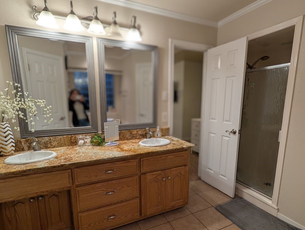 1231 Radisson Drive Hewitt, TX 76643 - Photo 33 of 51 a bathroom with a granite countertop sink and a mirror