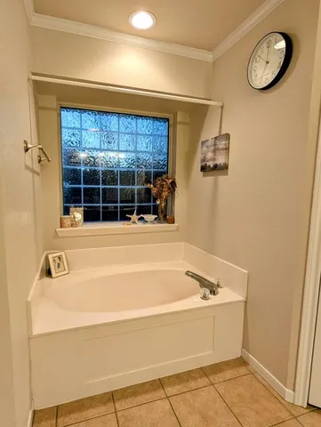 a bathroom with a granite countertop toilet and a sink