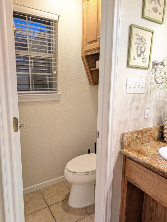 1231 Radisson Drive Hewitt, TX 76643 - Photo 37 of 51 a bathroom with a granite countertop toilet and a sink