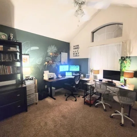 a view of a workspace with furniture