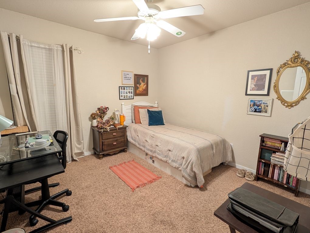 1231 Radisson Drive Hewitt, TX 76643 - Photo 40 of 51 a spacious bedroom with a bed a couch and a chandelier