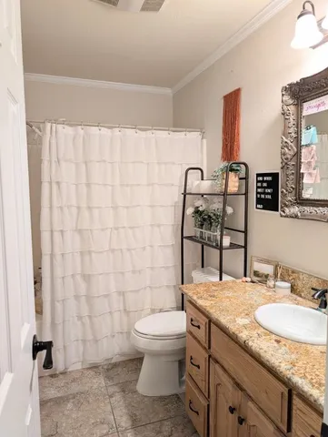 a view of a porch with a floor to ceiling window next to a yard