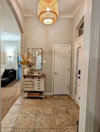 a view of a hallway with seating area